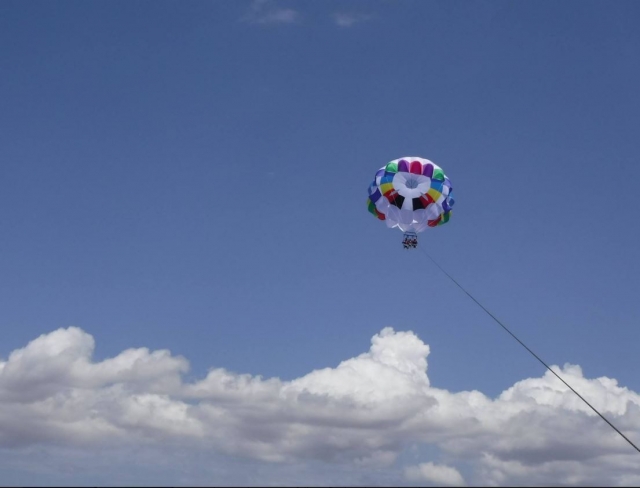 Parasailing dozens of meters above the sea 